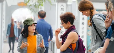 Local guide leading travelers on a private Hanoi History & French Quarter Walking Tour in Hanoi